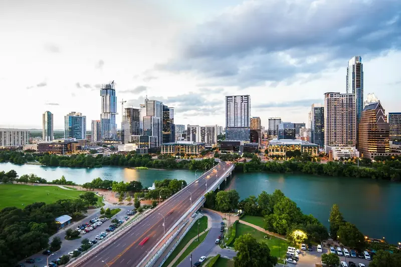 Downtown Austin office towers beside the lake in daylight